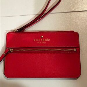 Kate Spade Mikas Pond Bee leather wristlet in a bright red. 6x3”. Like New!